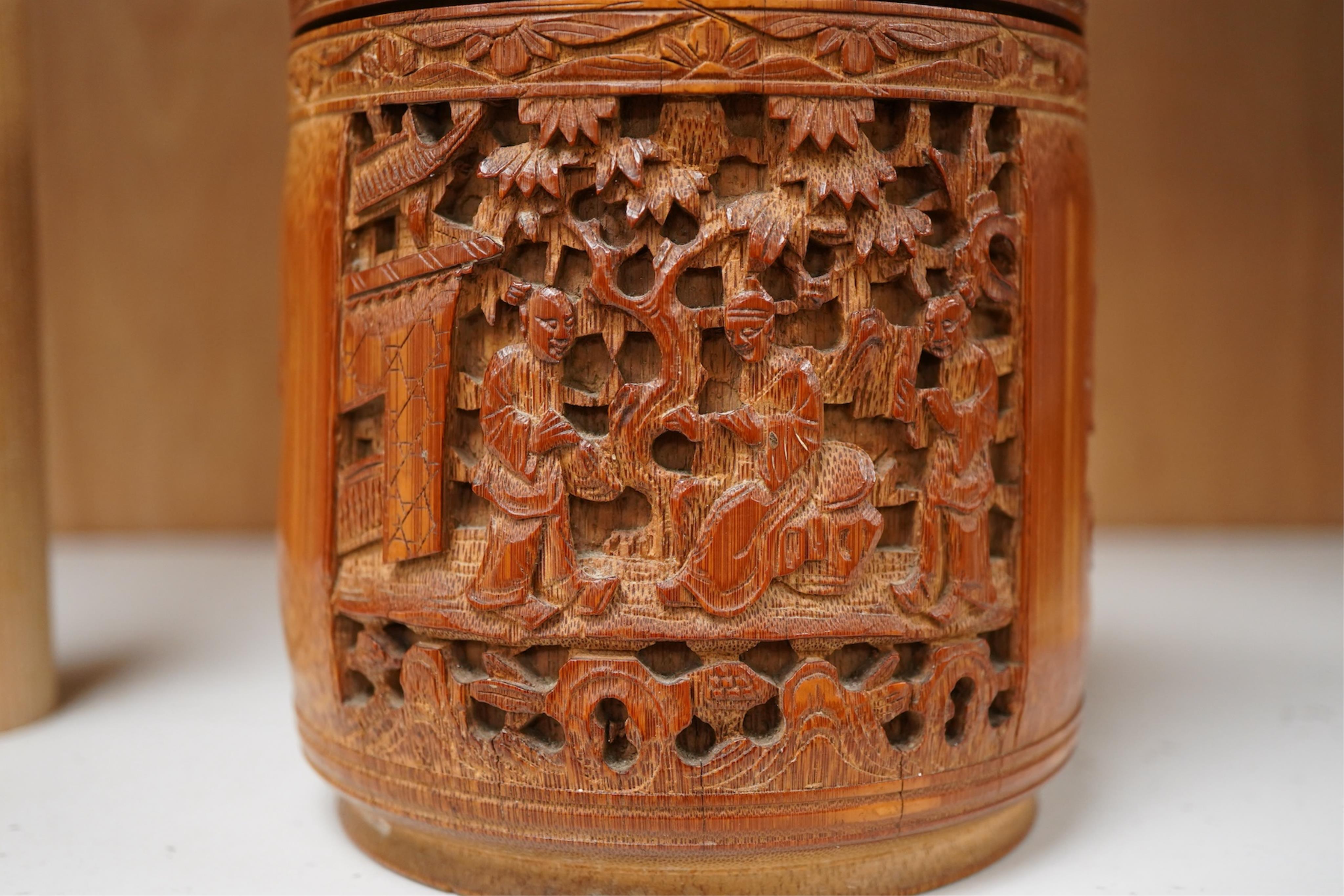 A Chinese carved bamboo tobacco jar and cover, 15cm high